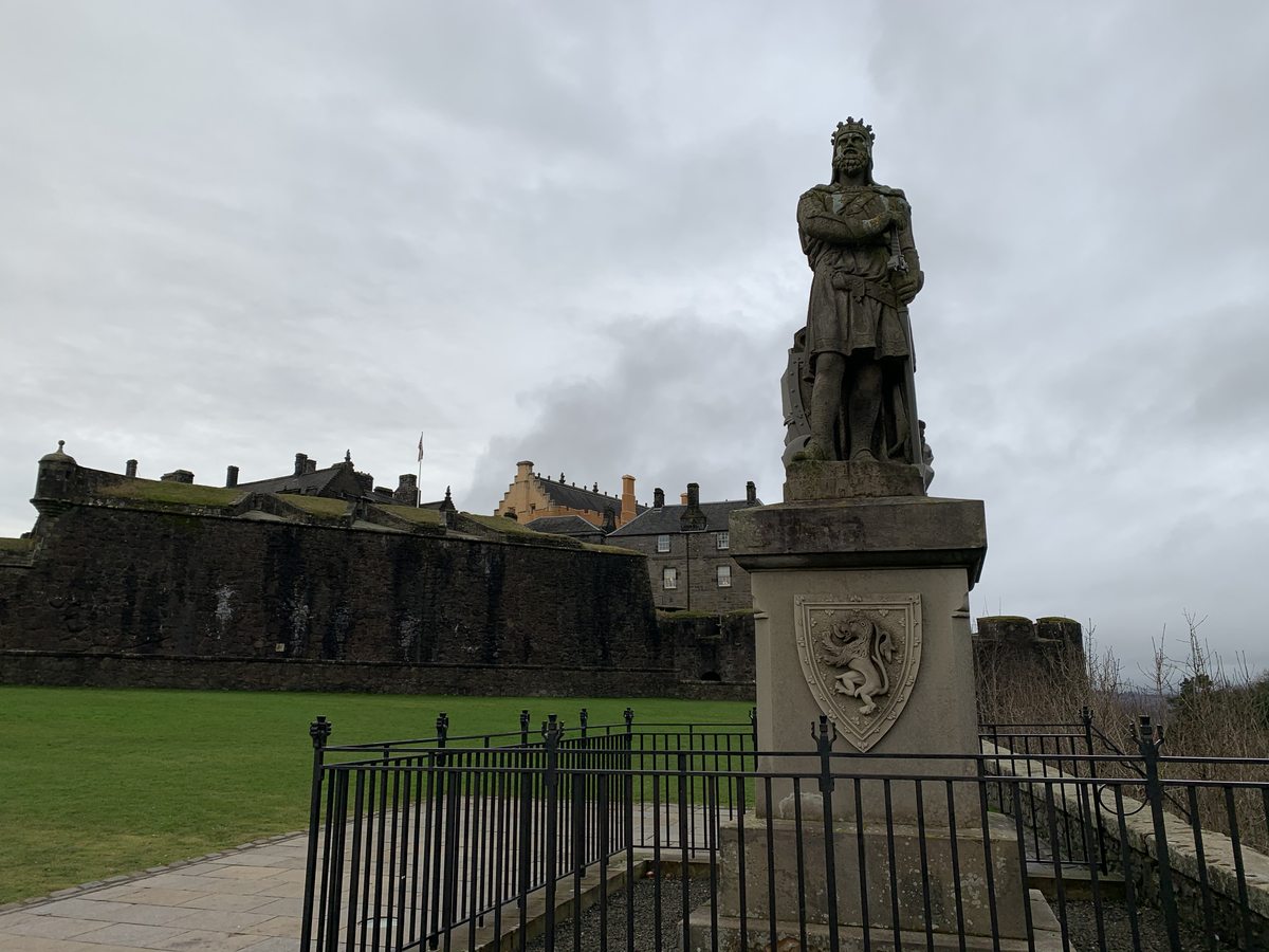 Robert the Bruce statue with Stirling Castle walls, Scotland
